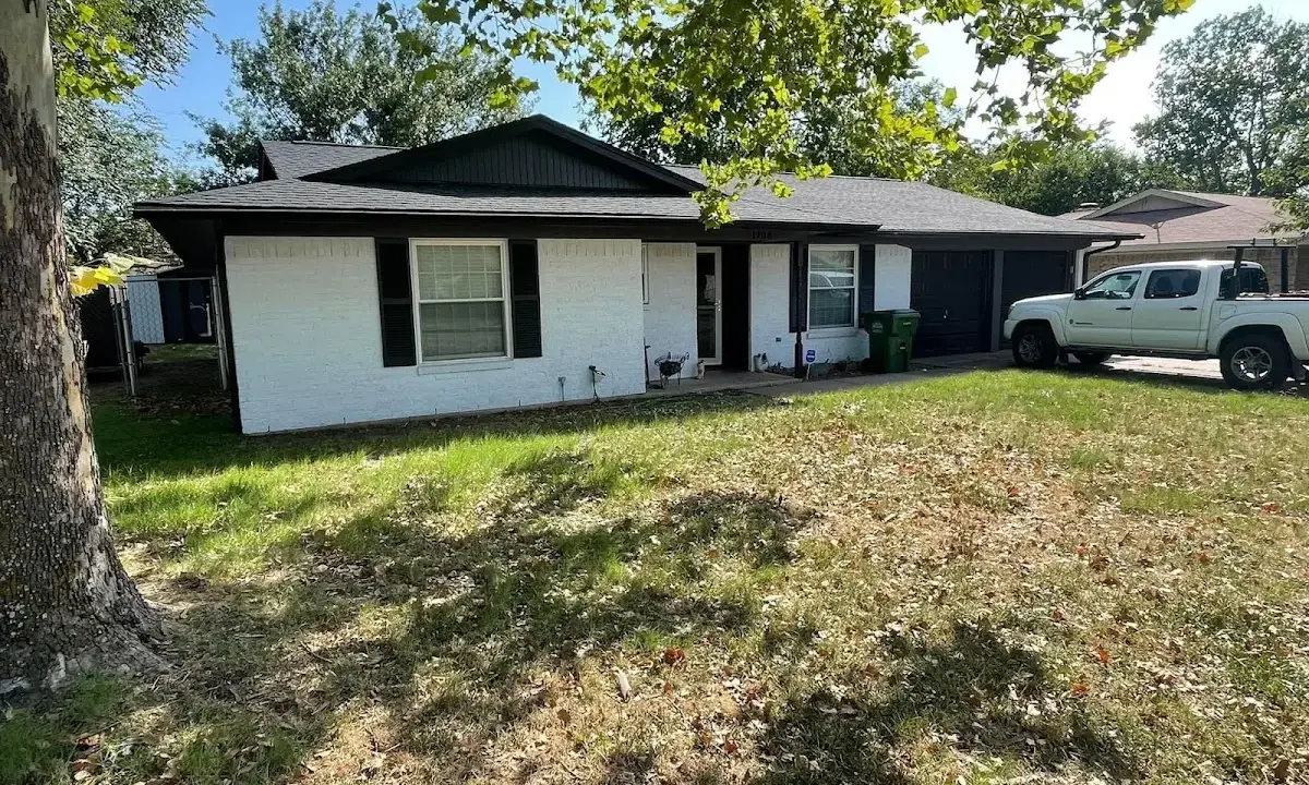 Professional roofing crew working on a residential roof in Johnstown